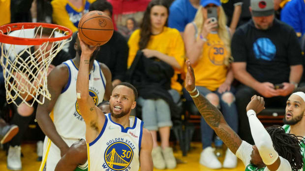 Jun 2, 2022; San Francisco, California, USA; Golden State Warriors guard Stephen Curry (30) shoots the ball against the Boston Celtics during the first half of game one of the 2022 NBA Finals at Chase Center. Mandatory Credit: Darren Yamashita-USA TODAY Sports